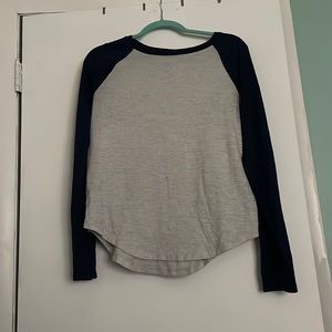 Light grey and navy blue cozy top. Size medium but fits like a small.Gently worn